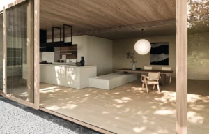 Snaidero Sistema Elementi mit heller minimalistischer Küchenzeile, Esstisch und Holzdecke in offenem Raum mit Blick in den Garten