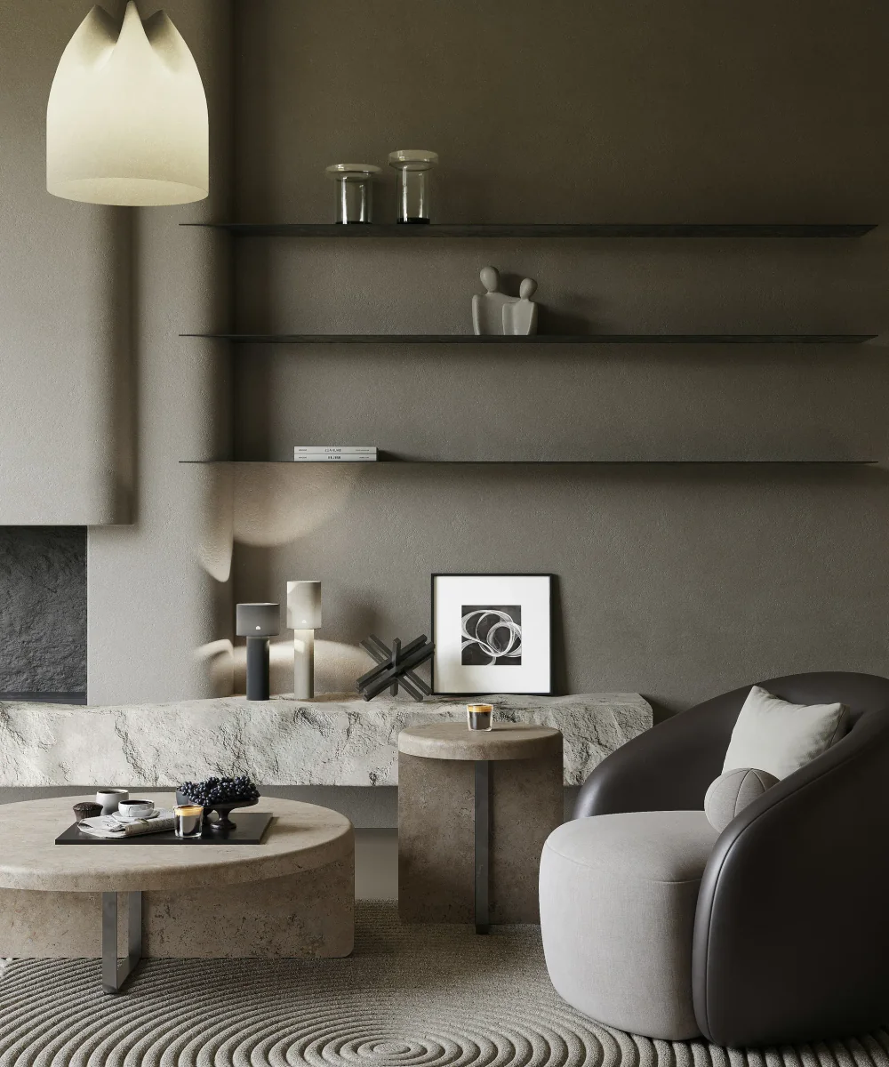 Japandi Lounge mit Travertintischen vor schwarzer Wand